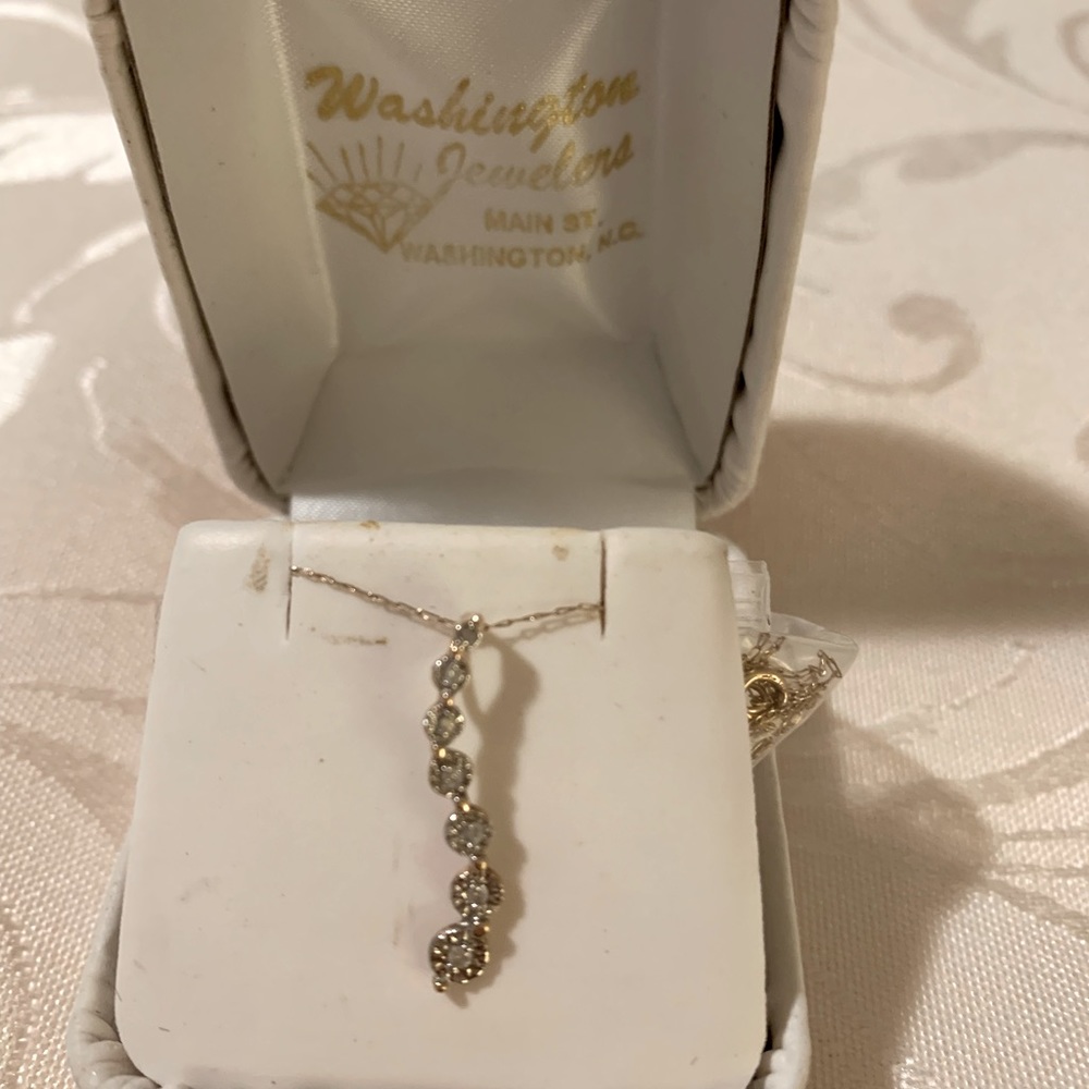 14k gold, very fine chain, genuine small diamonds.